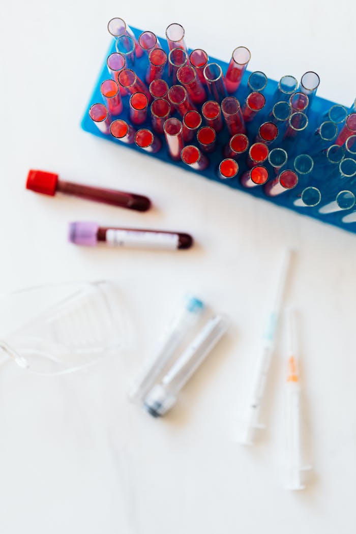 our-services-2 Vibrant laboratory test tubes and medical equipment on white background.