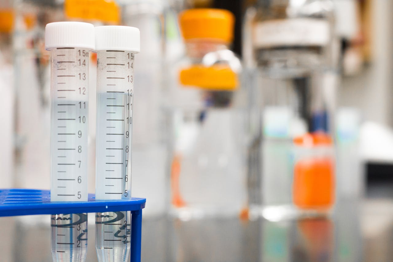 about-img Two clear test tubes in a laboratory, essential for scientific research.